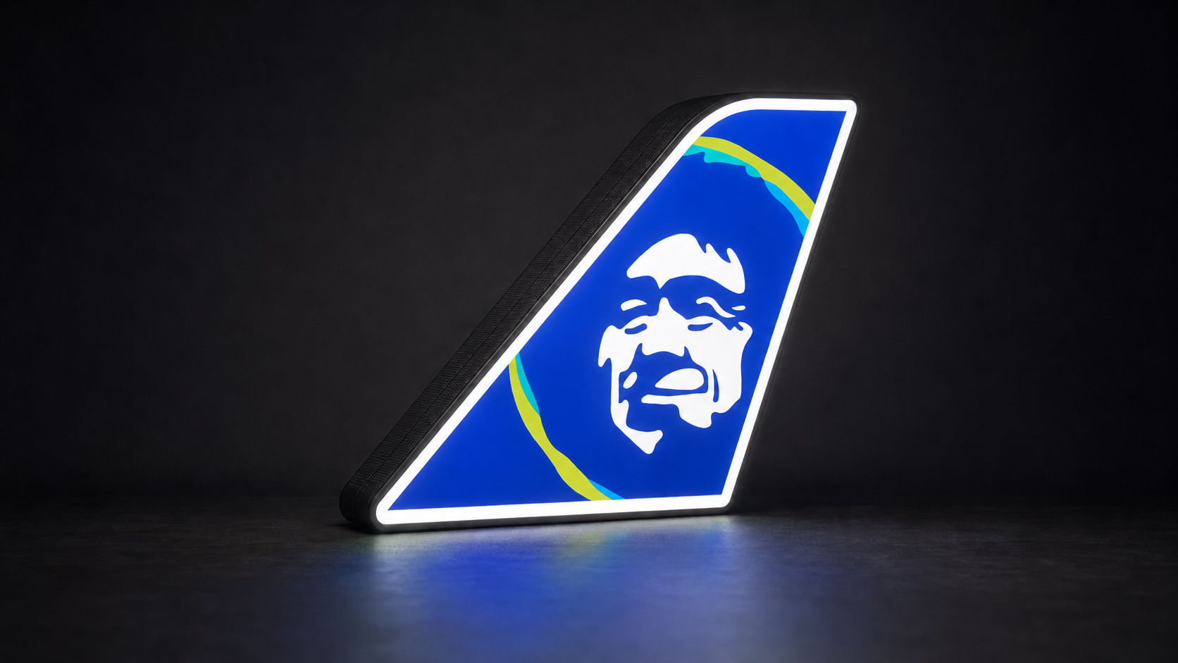 Alaska illuminated tail light with clean uninterrupted artwork
